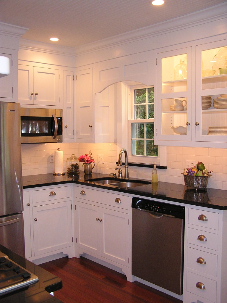 white kitchen, colonial toe kick, lighted cabinet